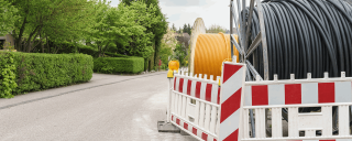 Photo of large cable spindles on roadside
