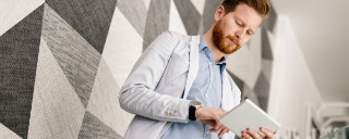 woman petting dog on beach